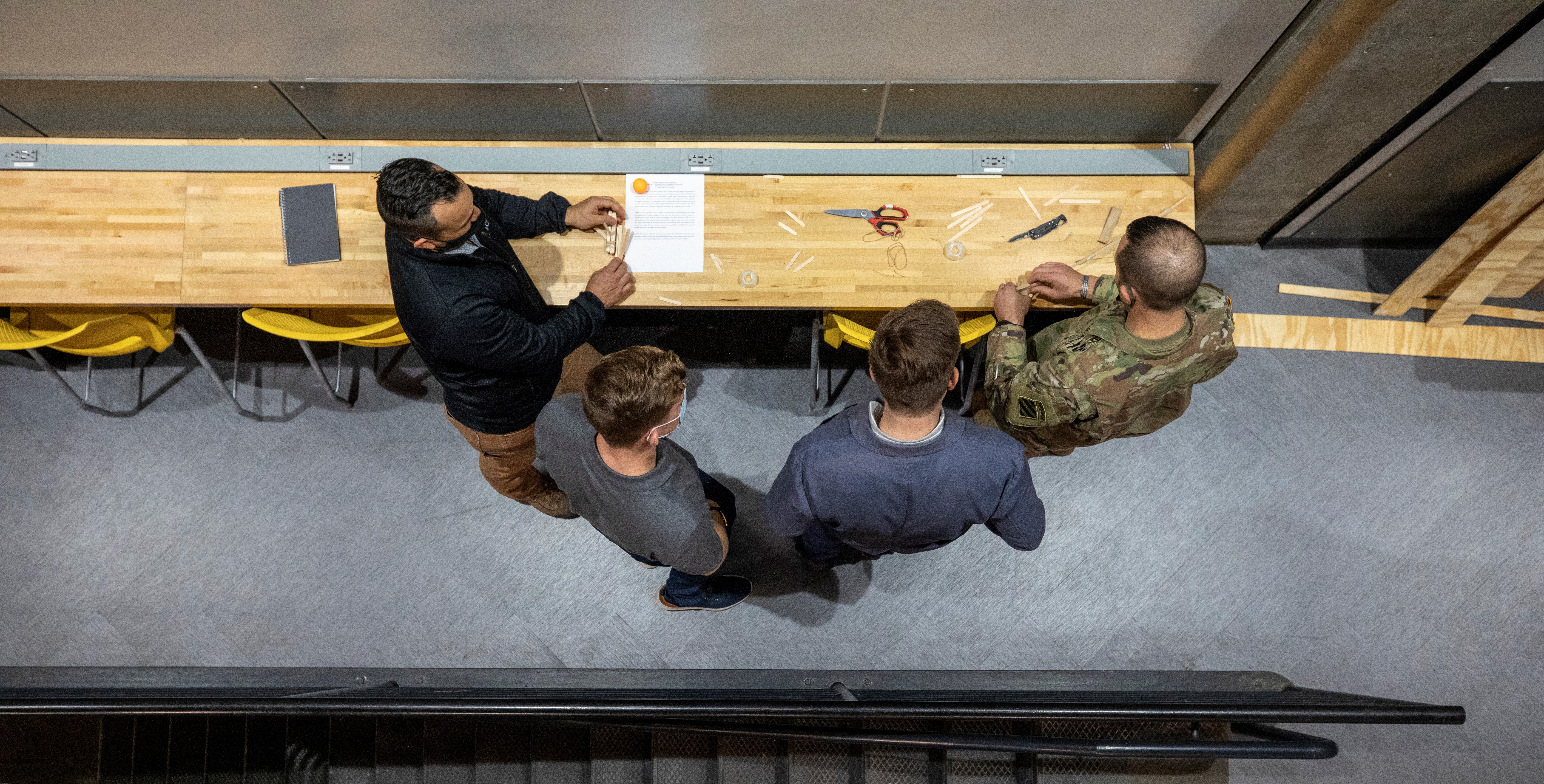 Soldiers, students, and researchers collaborate at a table during the Marne Innovation Workshop. (Photo Credit: Sean McNeil)