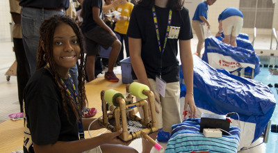 Student competitors work on their underwater ROV during the competition.