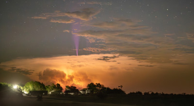 Blue jet rising above a thunderstorm.